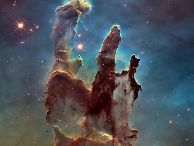 The famous Pillars of Creation revealed by the Hubble Space Telescope in high definition. Multiple pillars of brown gas and dust with potential stars in protruding fingertips, with a background of green and blue gas.