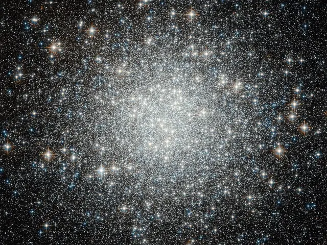 Large galaxy that's globular in shape, the closer to the center you get the brighter and whiter the image due to the amount of stars. Stars are everywhere in this image, of all sorts of colors.