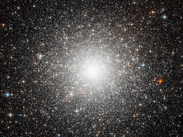 Large galaxy that's globular in shape, the closer to the center you get the brighter and whiter the image due to the amount of stars. Stars are everywhere in this image, of all sorts of colors.