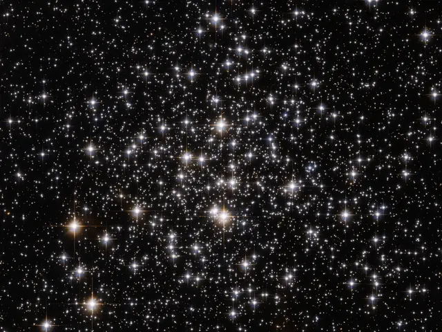 Several stars shine against black space.