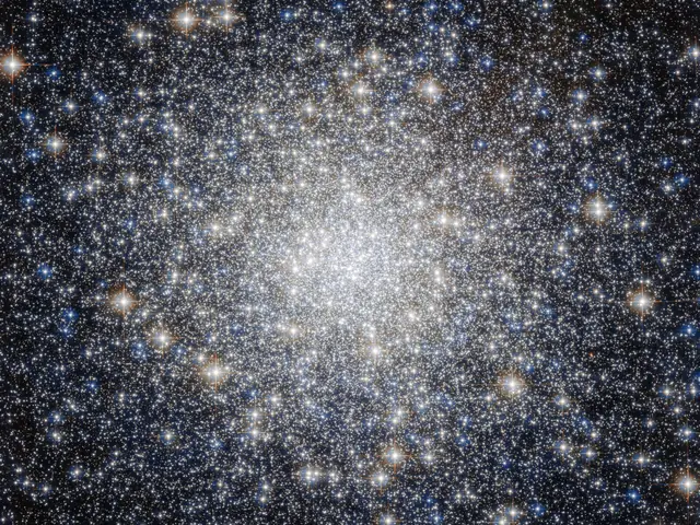 A bright cluster of stars, more concentrated at the center.